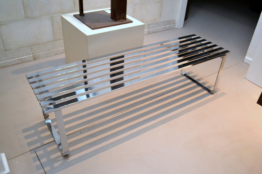 A mid-century classic vintage chrome slat bench designed by Milo Baughman.  This piece works perfectly if used as a coffee table by placing glass on top.