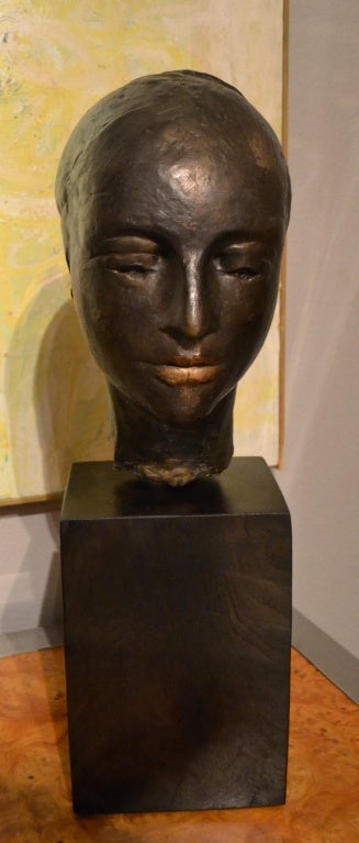 Elegant in stature, regal in position and important in execution by artist William Lasansky (1914-1997). This Head of a Lady is bronze with a dark bronze patina overall, except where the artist has carefully polished the patina away to read as a