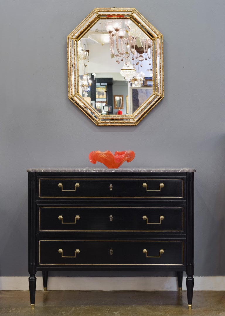 Antique Italian wall mirror with gold leafed & mirrored octagonal fir frame.