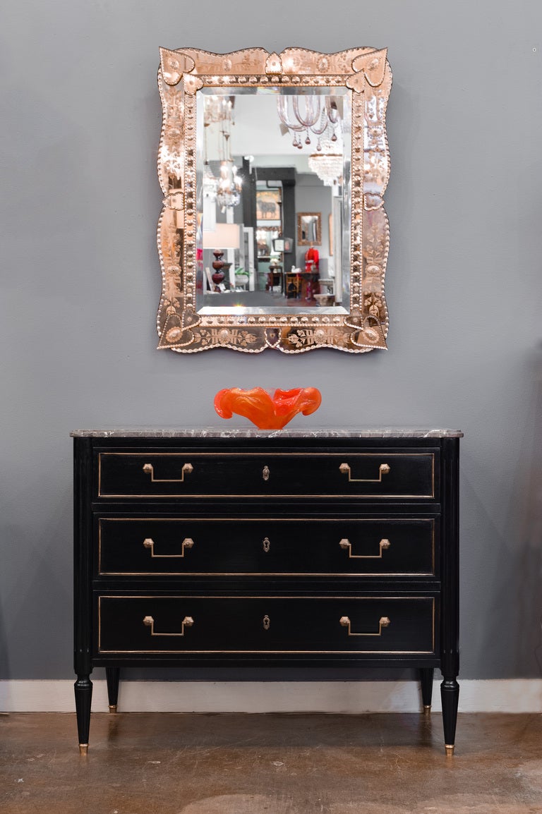 Vintage Venetian glass mirror with layered, copper colored, mirrored glass frame, with floral etchings and scalloped edges, embellished with glass flowers.