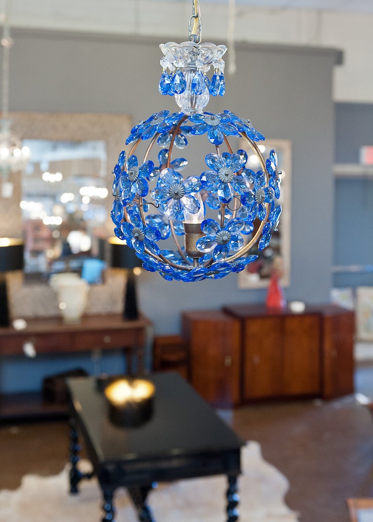 French antique chandelier in brass with sapphire blue crystal flowers. Single interior candelabra light, rewired to US standards. height including chain and canopy is 30 inches.