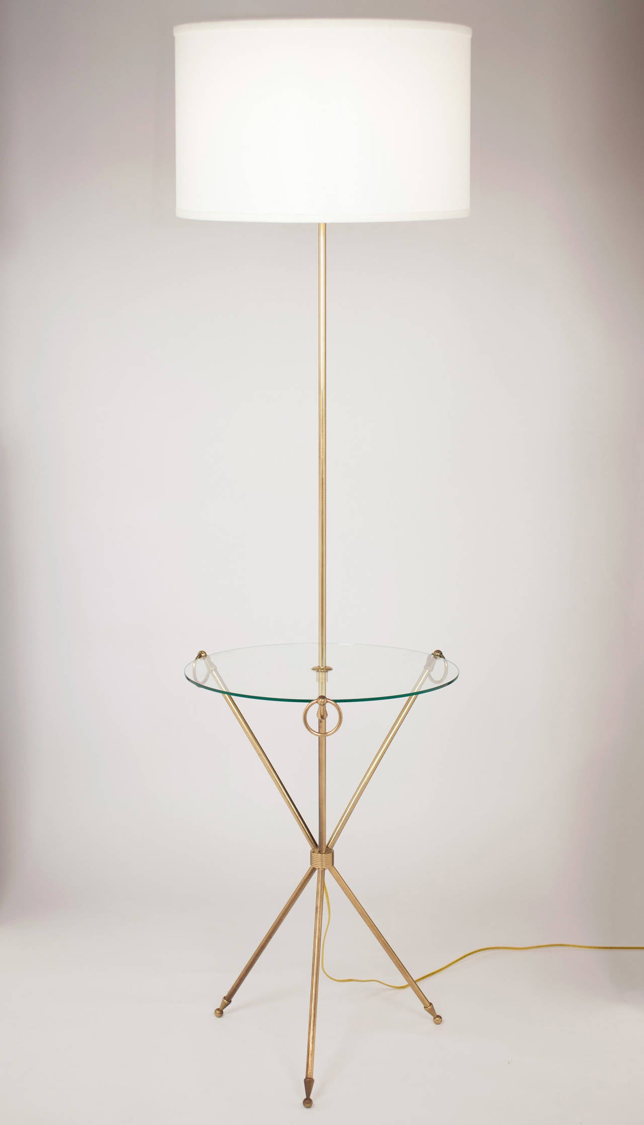 French vintage floor lamp and side table in brass and glass by Maison Jansen. The height of the table is 25.75 in.