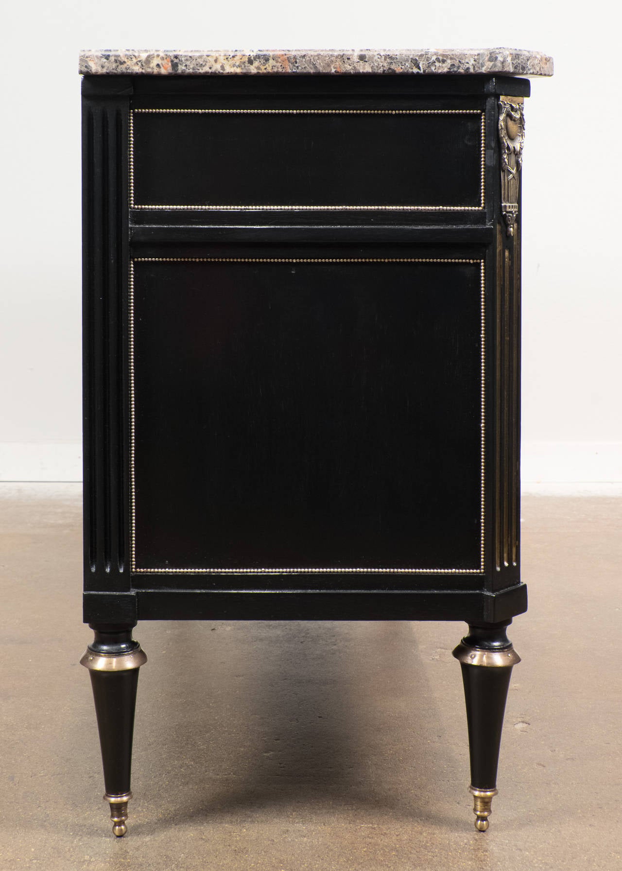 Early 20th Century French Louis XVI Ebonized Marble-Top Commode