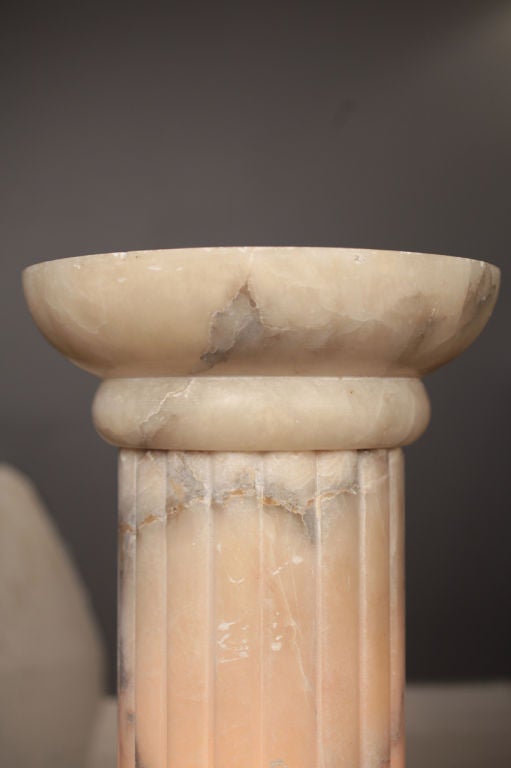 French Neoclassic alabaster column, hand carved fluted detail, gorgeous veining. A strong, elegant pedestal. Electrified. Rewired for the United States.