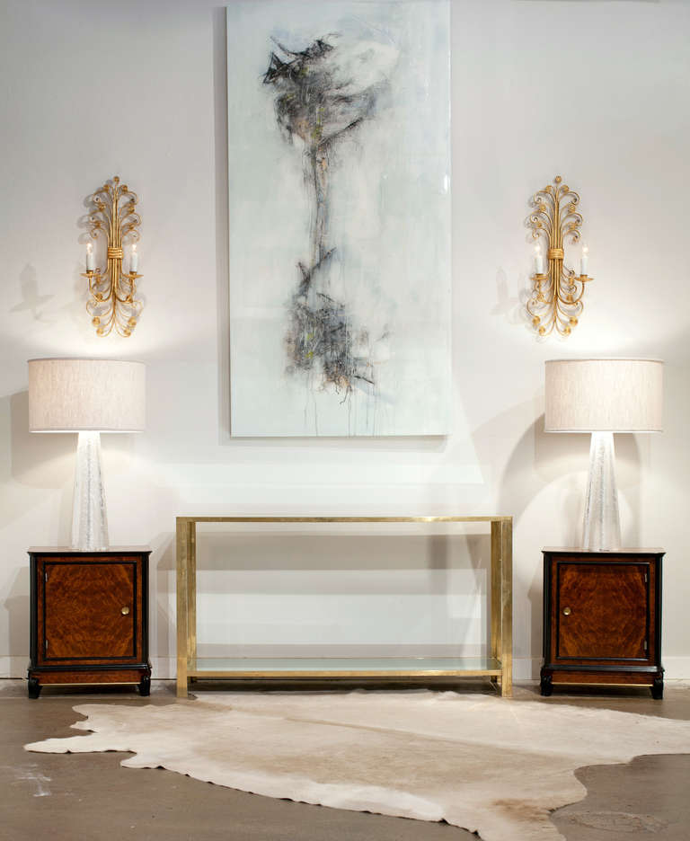 Fine French vintage console table in brass with mirrored glass top and bottom shelf. Perfect proportions, beautiful patina. A strong and clean statement.