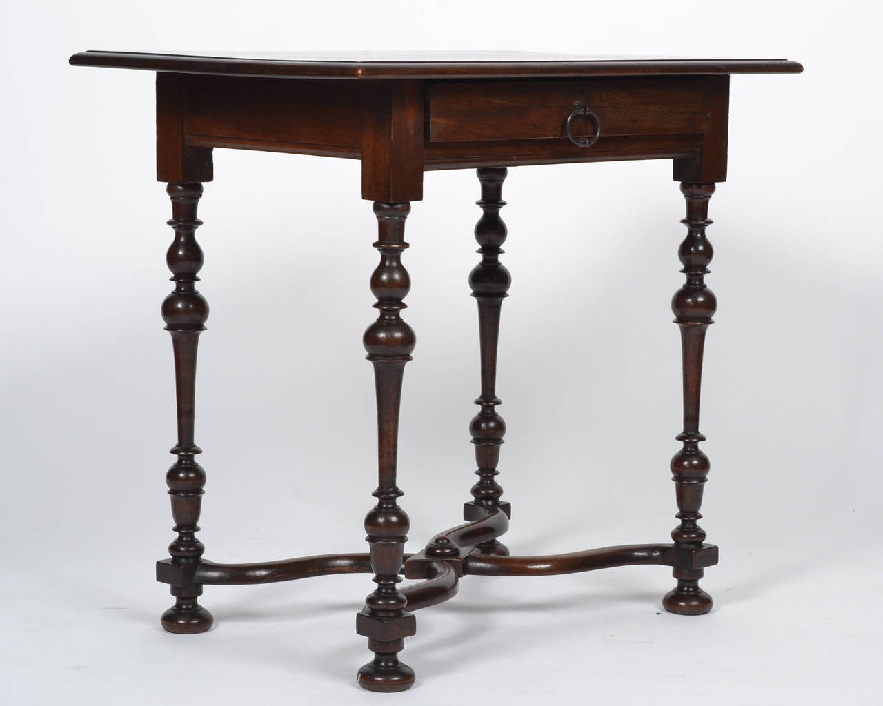 French 19th century writing table in Louis XIII style, with solid walnut construction, hand-turned legs, and a single drawer with original iron pull.