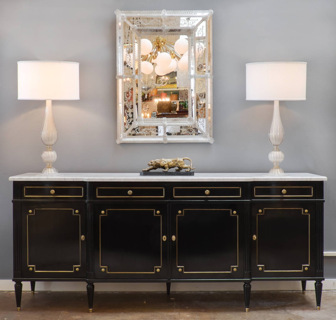 Antique French Louis XVI style buffet in ebonized mahogany with a lustrous French polish finish, oak as a secondary wood, original intact Carrara marble top. This piece is of the same quality and design of identical 