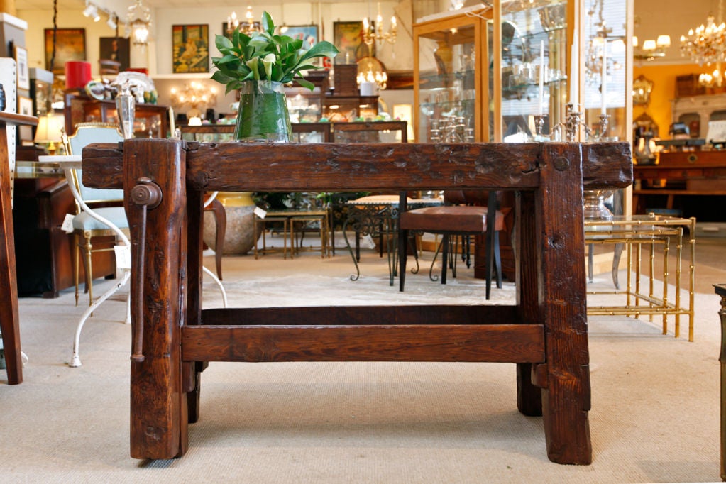 Unique French solid chesnut Carpenter's workbench, beautiful patined slab top and legs. Original forged iron vis. The most wonderful and unusual sofa table.