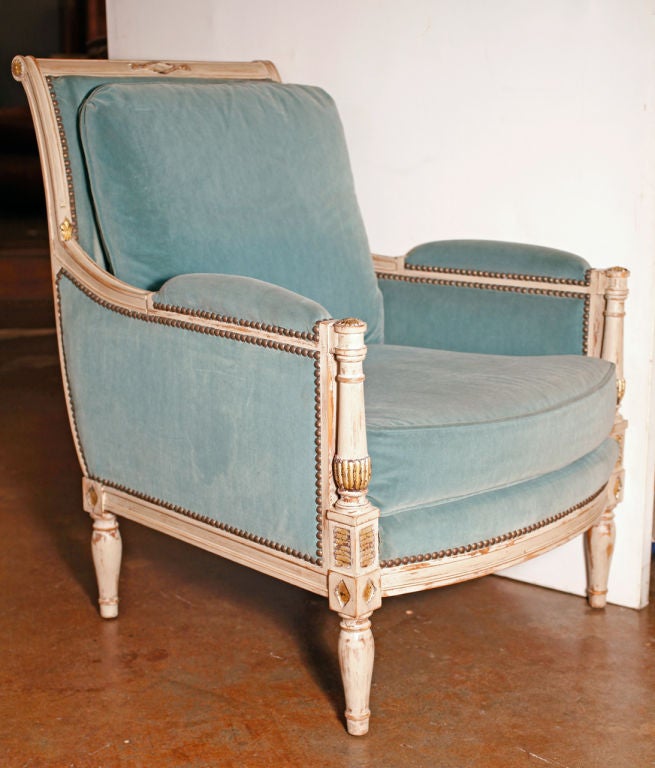 French Antique pair of Directoire style Bergeres in solid cherrywood, hand painted and patined with gold leafed accents. Original light blue turquoise velvet. Very comfortable and strong. Quality construction and details. Signed Jean Roche (Paris).