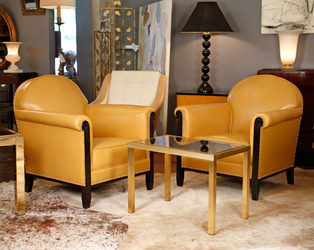 Exceptional pair of mustard colored leather armchairs, ebonized and French polished fruitwood, great style and proportion. Very strong and comfortable.