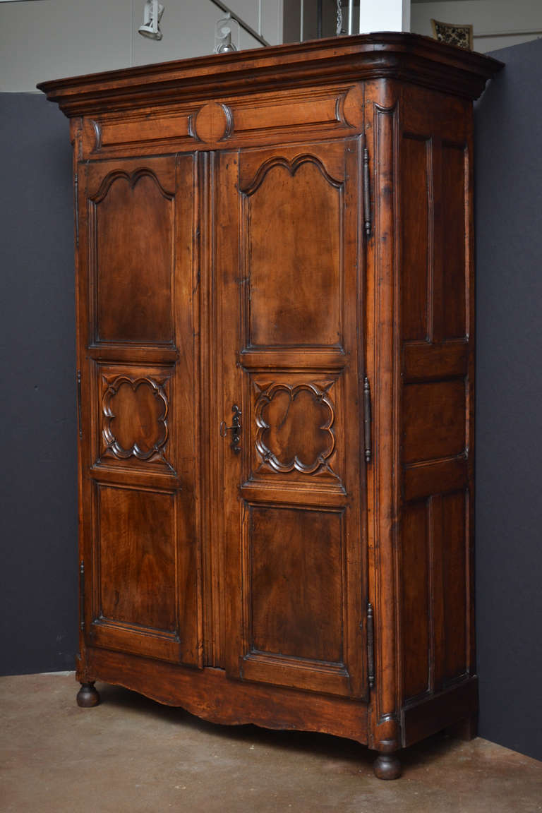 Early 18th Century French Hand-Carved Walnut Armoire from Lyon In Good Condition In Austin, TX