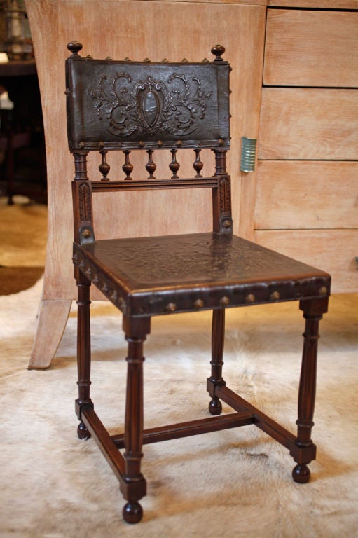 Napoleon III period chairs, solid hand-carved walnut frame with amazing embossed work on seat and back. All original studs. An unique set from the Romantic era when Victor Hugo wrote Notre Dame de Paris...