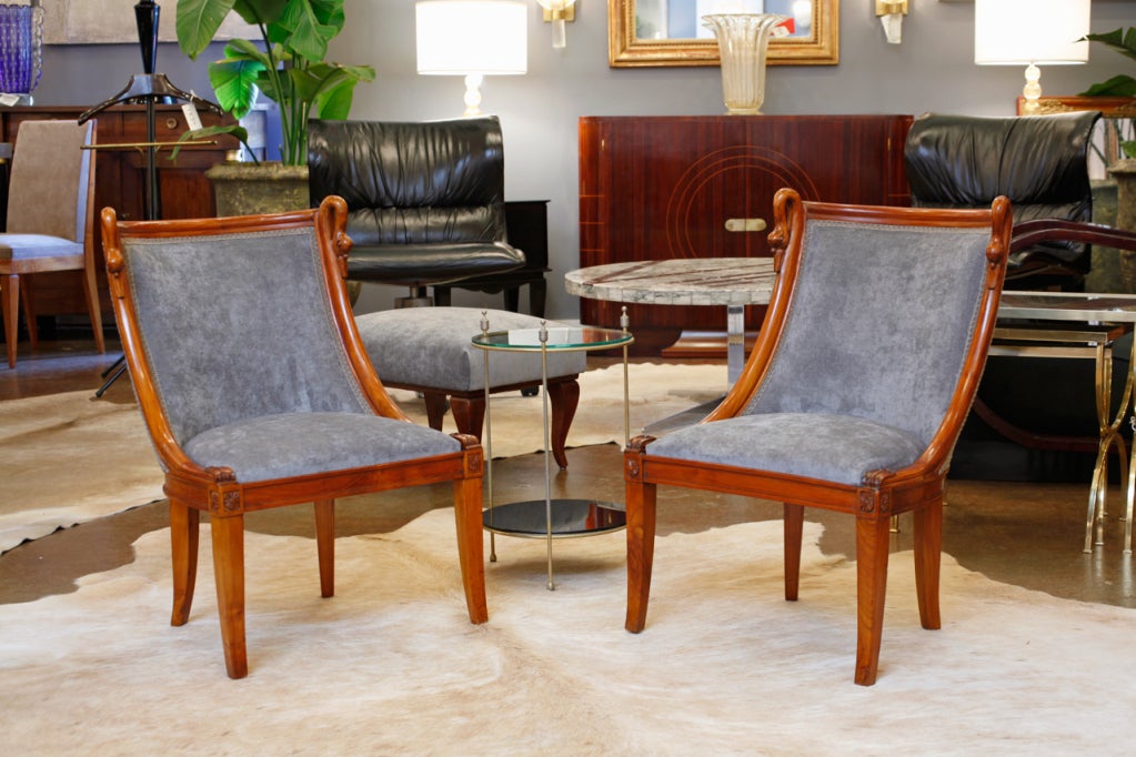 Pair of French Empire style mahogany gondola chairs with beautiful swan detail. Recently reupholstered in a velvet blend.