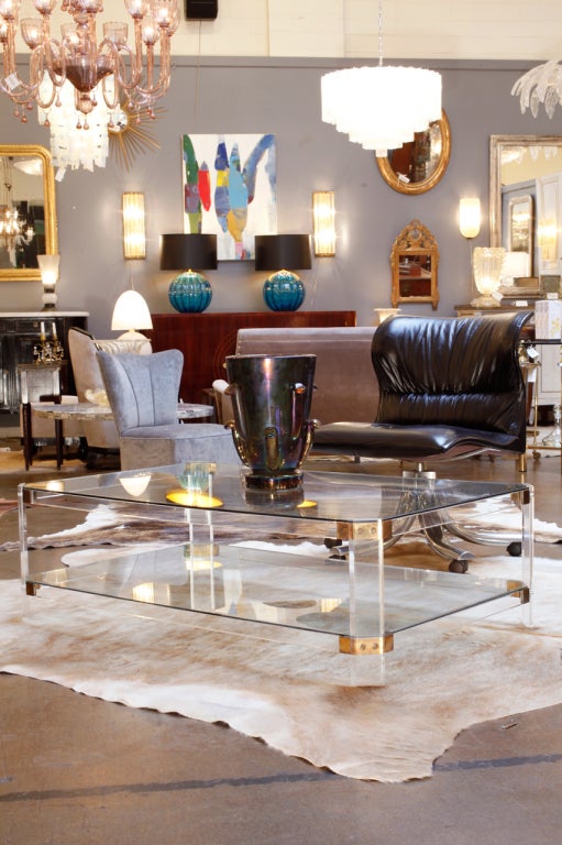 French vintage lucite and brass coffee table with glass shelves.