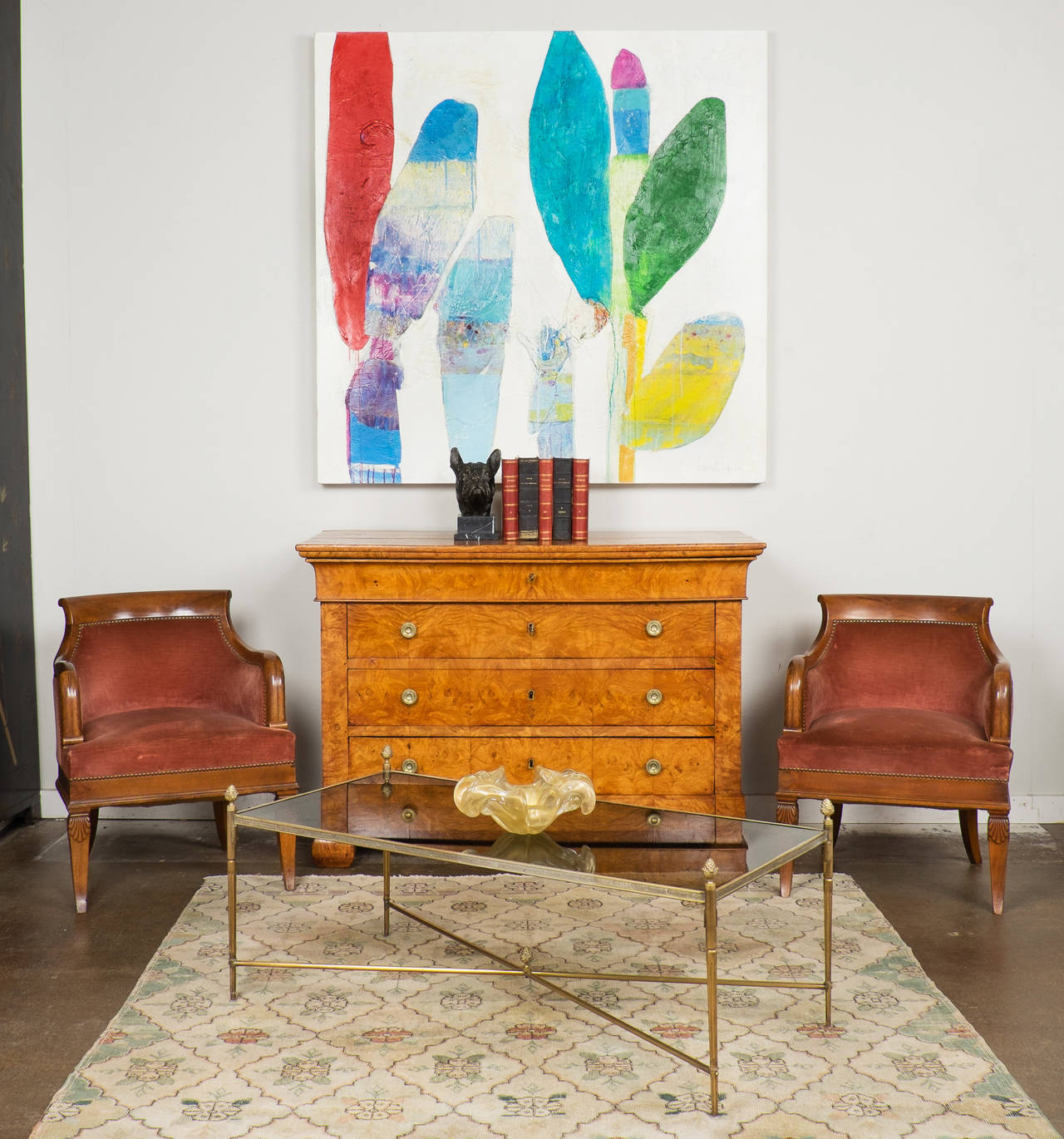 French vintage bronze and glass coffee table by Maison Jansen. Very fine cast and proportions. Acorn finials on each corner and on the X-stretcher, fluted legs and a smoked glass top.