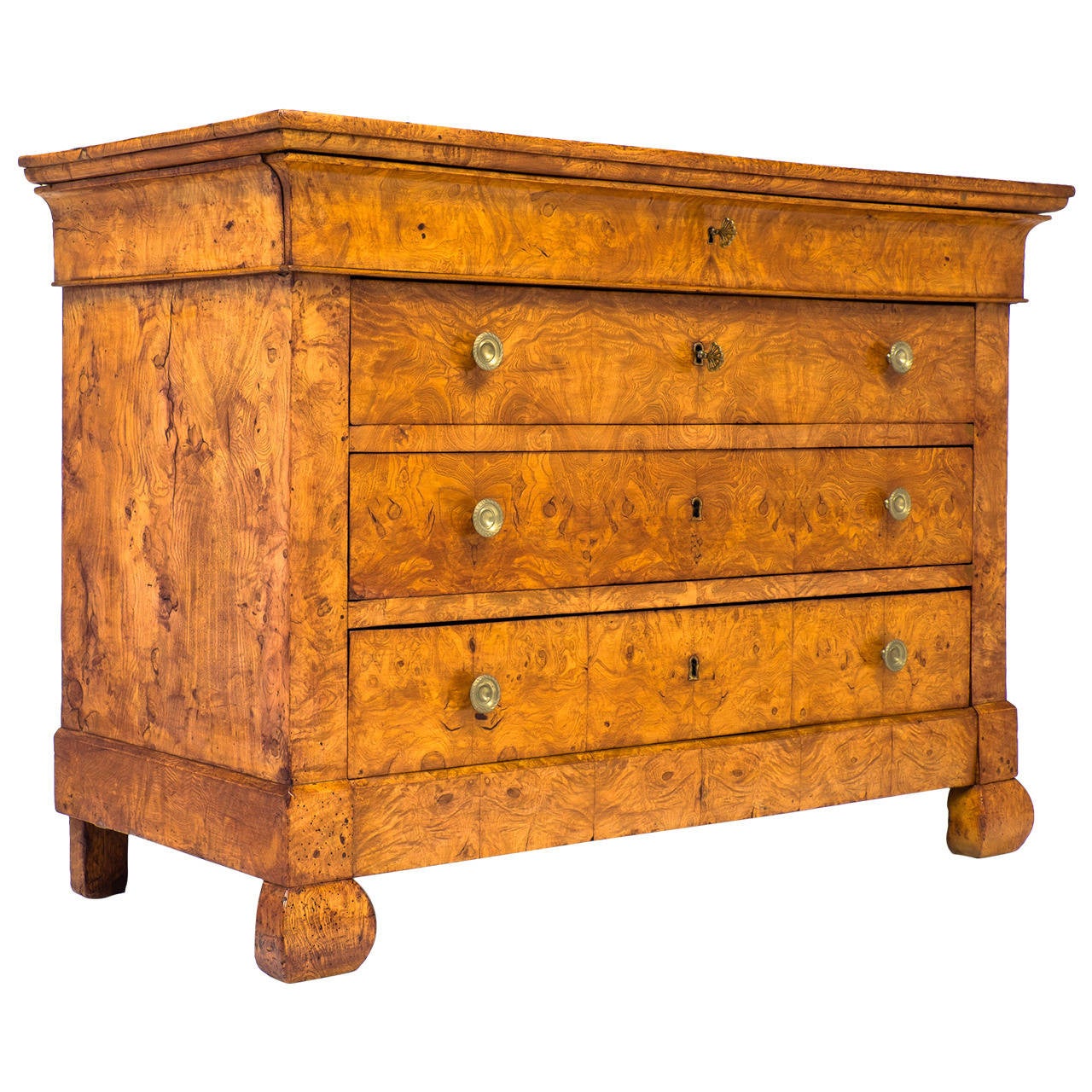 Rare and superb burl elm French chest of drawers from the Charles X period at the beginning of the Restoration period. Four dovetailed drawers with finely cast bronze hardware. The intricate figuring in the burl, the flawless construction, as well