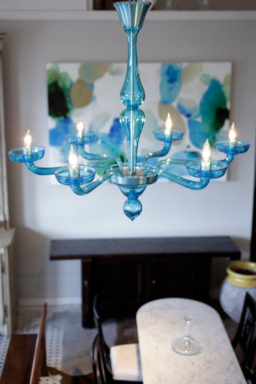 A cool cerulean blue Murano glass chandelier with 6 branches. A very nice transitional piece that will enhance any interior.

Rewired to UL standards.