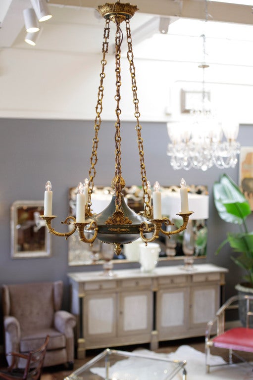 French Empire style gilded bronze and painted tole chandelier with six branches and matching canopy. 6 candelabra lights, rewired to US standards. Fine bronze casting with beautiful gilding (including on the chain, which is adjustable). A must have