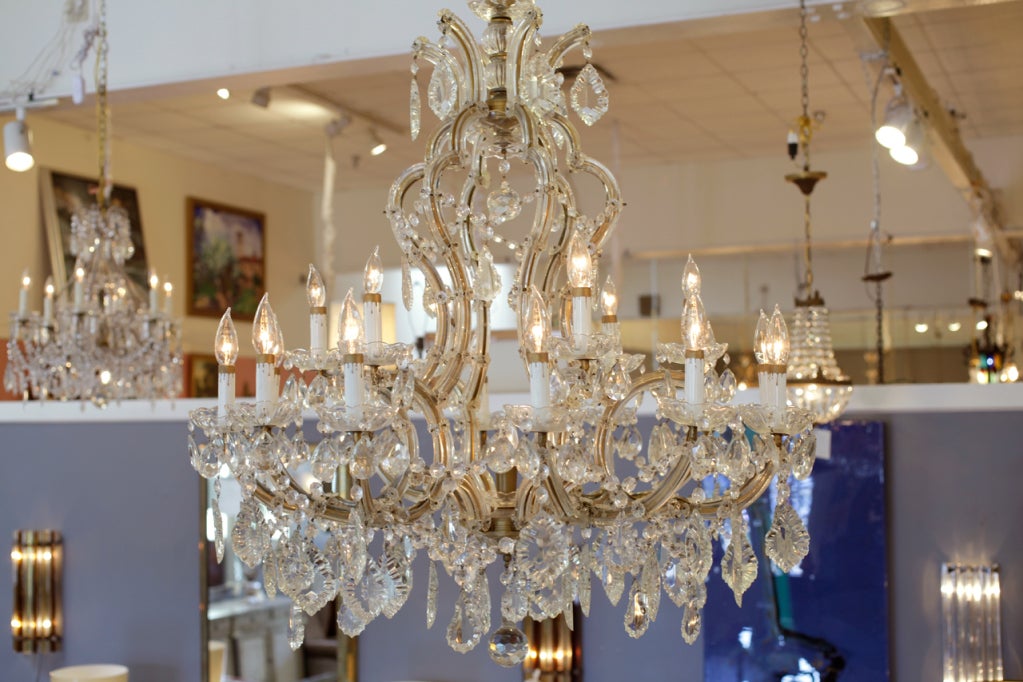 Grand Maria-Theresa chandelier. Glass covered structure, cut crystal pendants and bobeches. A grat classic piece, rewired to us standards.