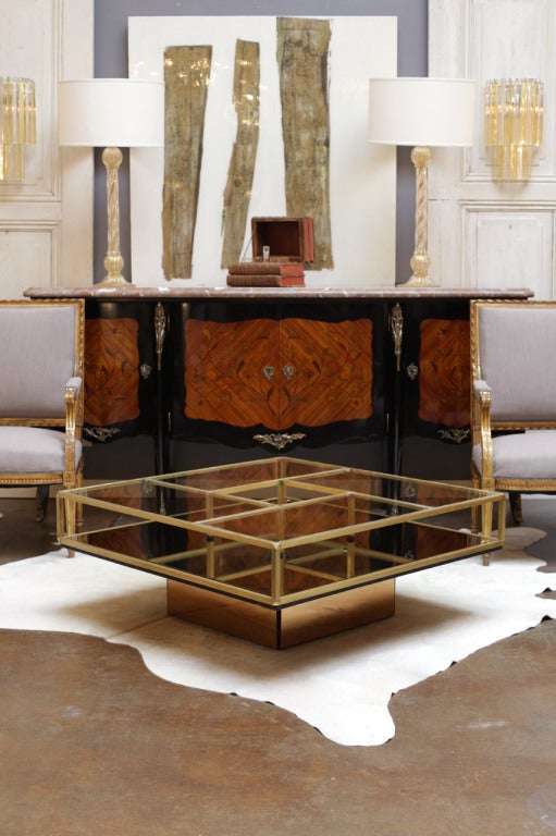 Vintage French coffee table with copper mirror base, gilded brass structure with central opening and partitioned glass top.
