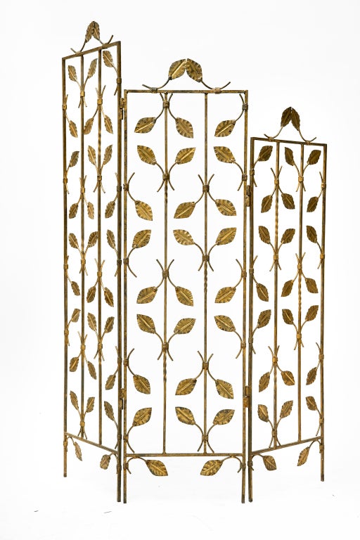 Spanish vintage gilded forged iron screen with three panels & leaf embellishments.