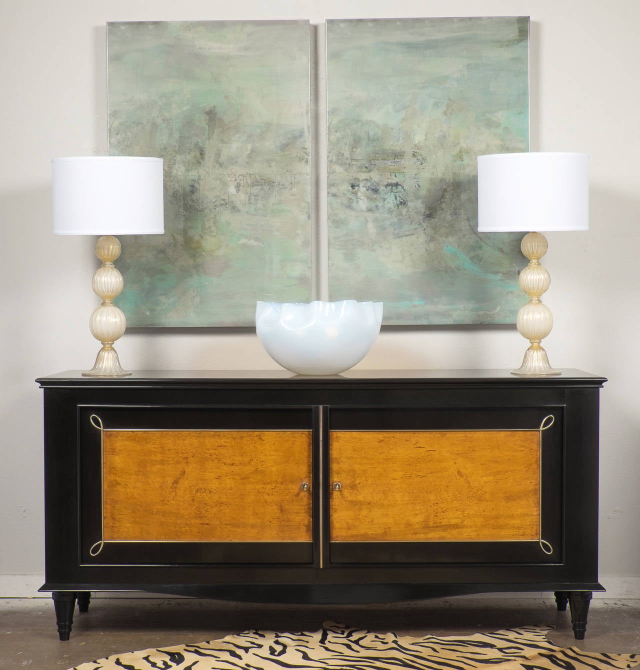 We couldn't resist the strong decorative impact for this gorgeous buffet in the manner of René Drouet. The burled ash doors finely trimmed with brass and the high luster French polish really make this piece a real stunner.