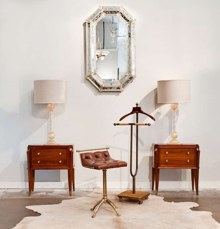 French vintage swiveling gilt brass harpist stool with tufted leather seat and claw feet.