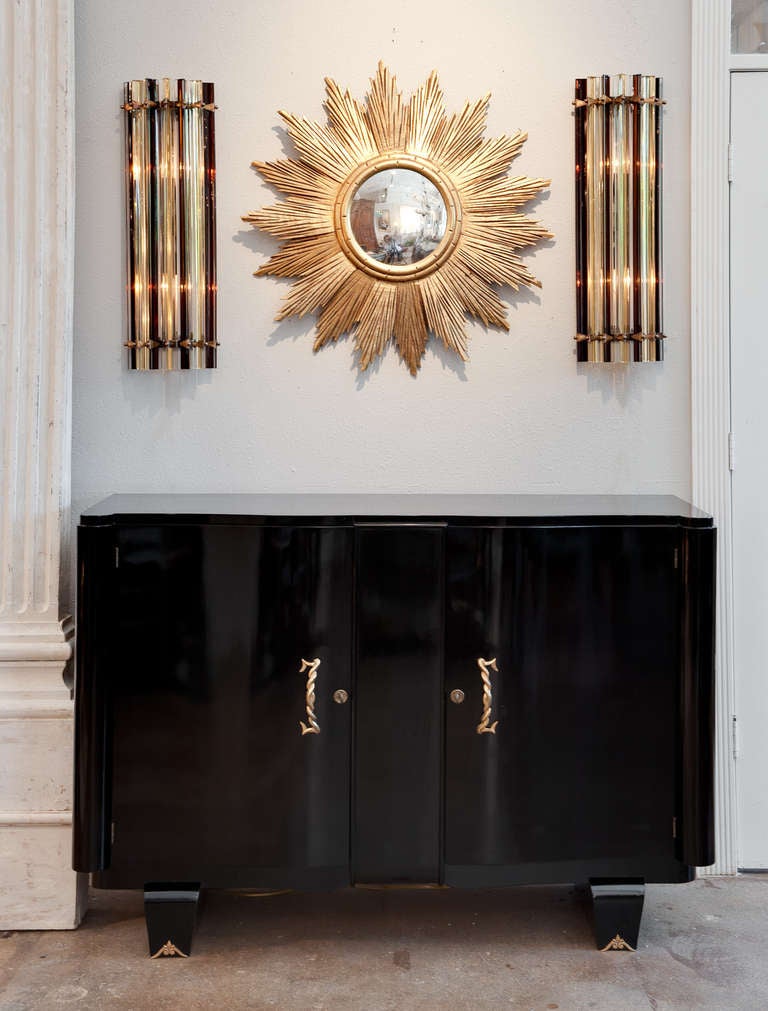 Beautiful pair of Murano glass sconces by Venini with alternating prisms in amber and dark tea colored glass, on a brass structure. Rewired for the US.