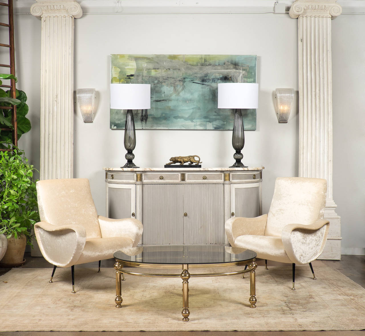 French vintage oval coffee table in solid brass with original smoked glass top.