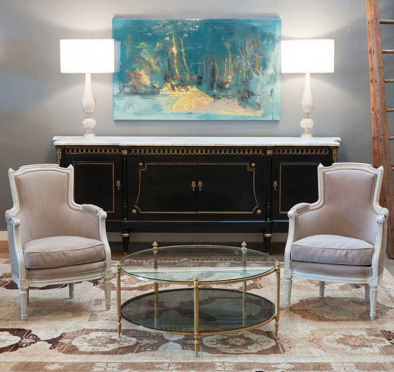 Spectacular enfilade of ebonized rosewood in the Louis XVI style with white and grey veined carrara marble slab. Rich decor of finely cast bronze element and gilt bronze trims. Impeccable yew wood interior cabinetry with red felt lining.