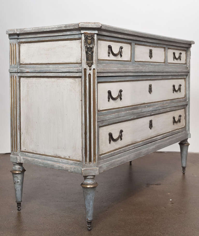 Superb French Louis XVI style chest of drawers in hand painted, solid cherrywood. Hand carved fluting, brass trim and finely cast original bronze hardware, beautiful details and patina. Flawless design and construction.