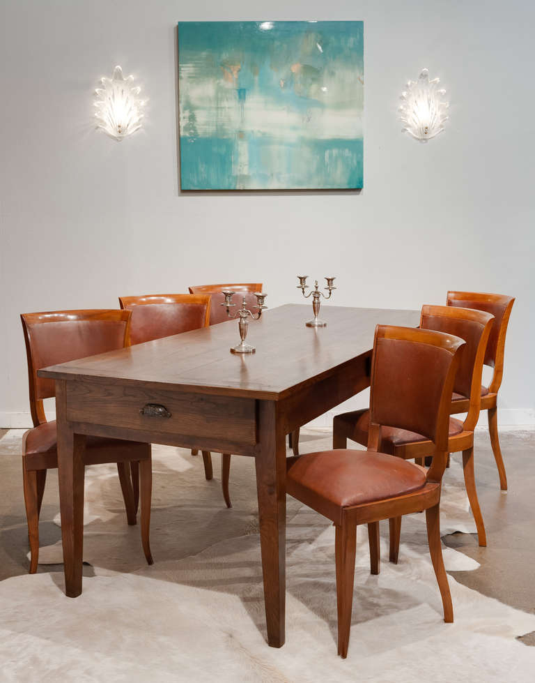 Beautiful, solid oak farm table from the Beaujolais region (north of Lyon). Strong, peg construction with planked tongue-and-groove top; a substantial drawer on each end and one on the side, all dovetailed with original hardware.