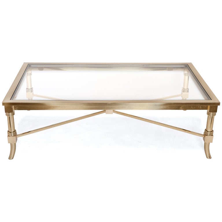 French vintage brass and glass coffee table by Maison Jansen. Strong, bold, and elegant design with impeccable finish.