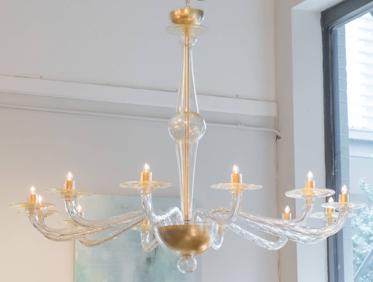 Italian modernist chandelier in Murano "avventurina" glass, with 12 torsado branches, rewired for the US. Height with included chain and matching glass canopy is 73 1/8 in. A very pure design in line with the works of Seguso.
Avventurina