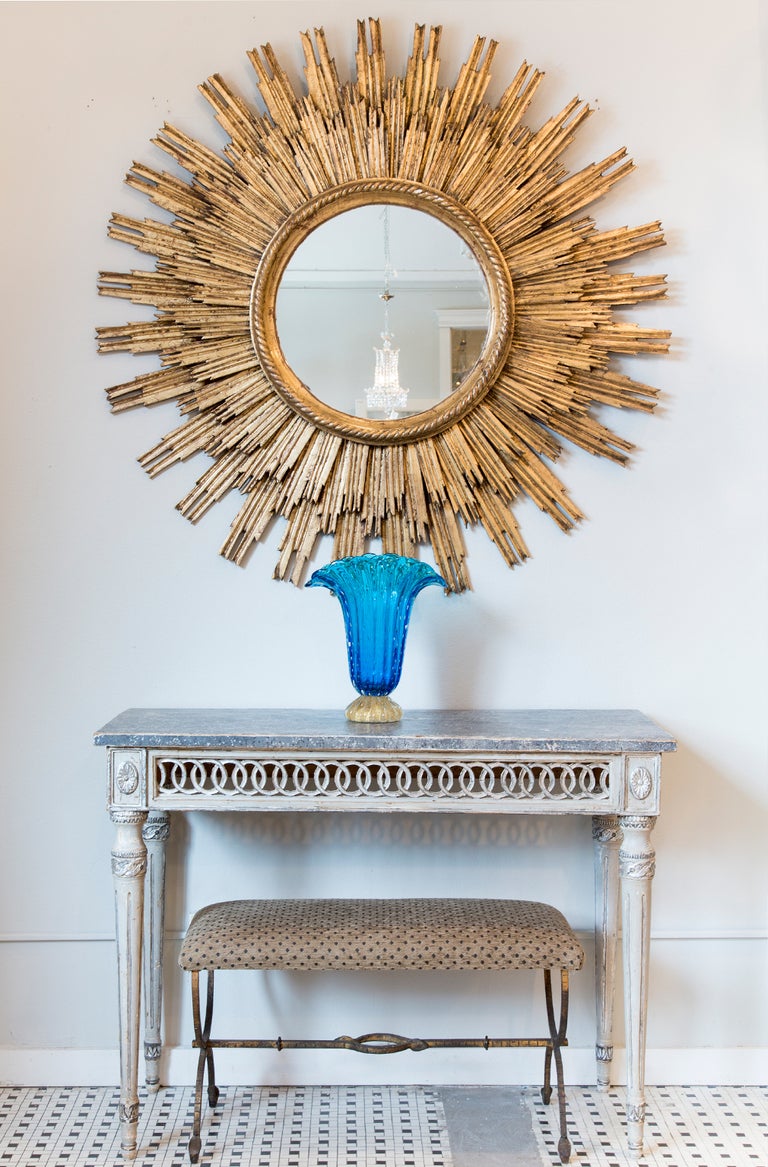 Superb pair of antique Italian console tables, beautifully hand-carved with medallions, opened frieze around the apron. Faux painted marble top.