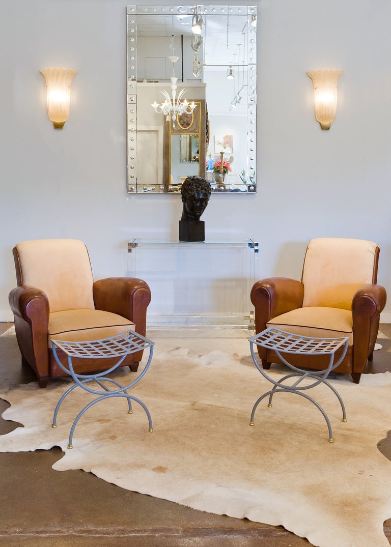 French vintage lucite console table with chrome corners and gilt brass square rings, and two glass shelves.