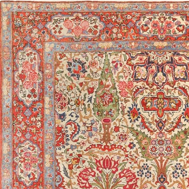 Regarded as the highest grade of carpets from Kashan, this antique Dabir rug displays a splendid directional repeating pattern with kaleidoscopic shapes and beautifully colored large-scale figures that display immense technical skill and