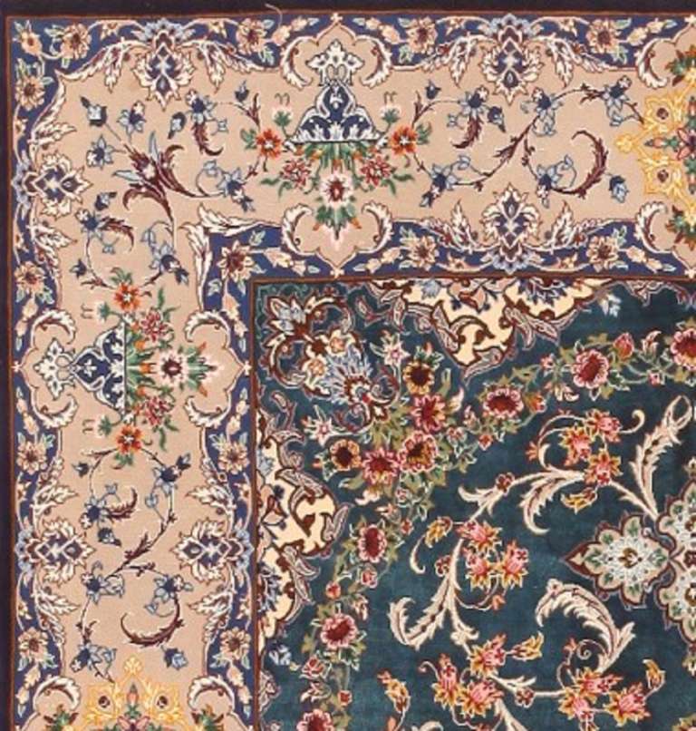 Crafted in the heart of Persia, this outstanding vintage medallion carpet redoubles the beauty of Esfahan's superfluous curvilinear designs. The spectacular field showcases a graceful scalloped medallion accompanied by fantastically detailed designs