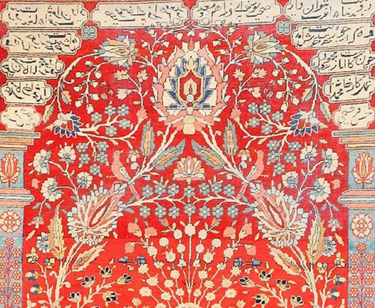 Epitomizing the technical skill and artistic finesse of the Mohtashem atelier, this antique vase carpet immortalizes an iconic pattern in the lavish, colorful style of Kashan. Inscribed cartouches and artful pillars with upright embellishments