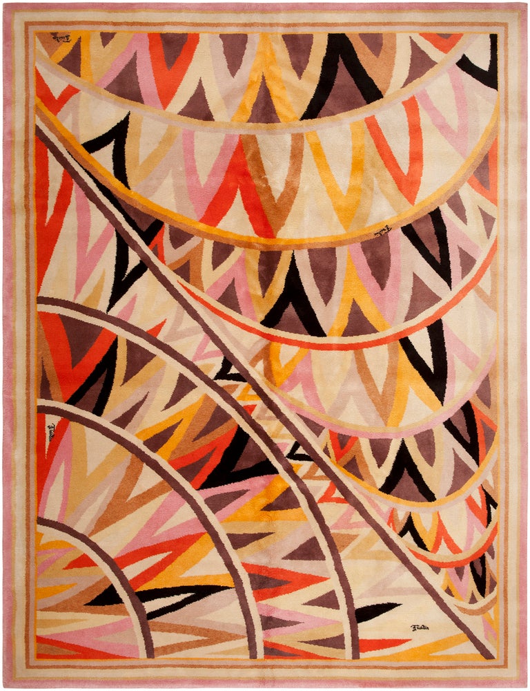 Crafted in France during the height of Emilio Pucci's mid-century fame, this thrilling vintage art carpet showcases a stellar geometric allover pattern with alluring tropical colors that epitomize his distinctive, original style. In true Pucci