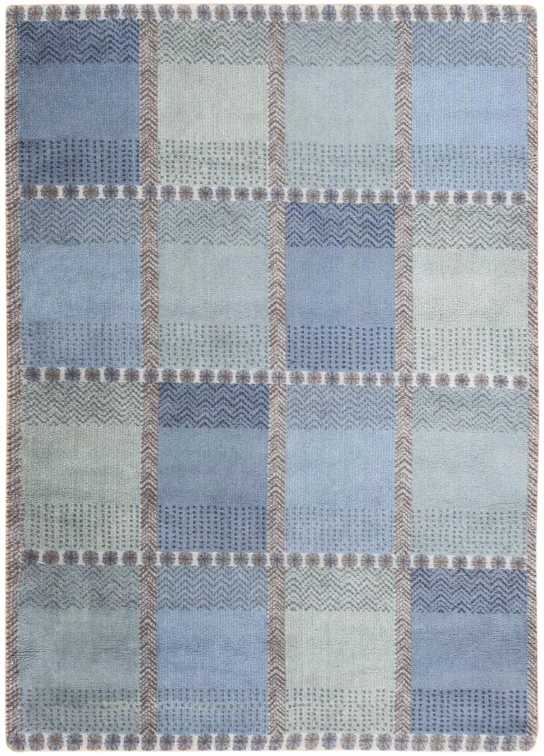Embodying the enduring design principle that less is more, this vintage mid-century Swedish rug is a glowing example of understated elegance. The well-defined compartmental decorations have strong directional lines and modern embellishments that are