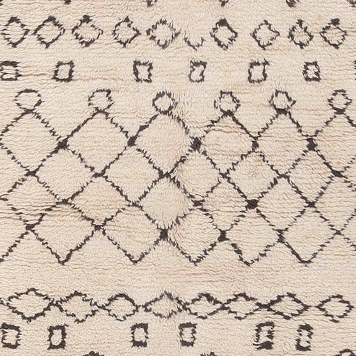 Rendered in a luxurious combination of woolly brown and ivory, this chic midcentury rug from Morocco features a series of lovely lozenges and latticework panels.

Vintage Moroccan rug, origin: Morocco, circa mid-20th century. This strikingly