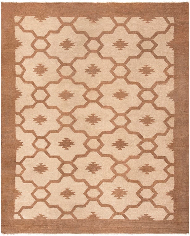 Created in Sweden, this gorgeous Scandinavian Kilim showcases a brilliant all-over pattern that is rendered in a chic, understated palette of modern earth tones. Based on age-old geometric principles, the tessellating tile motifs depict undulating