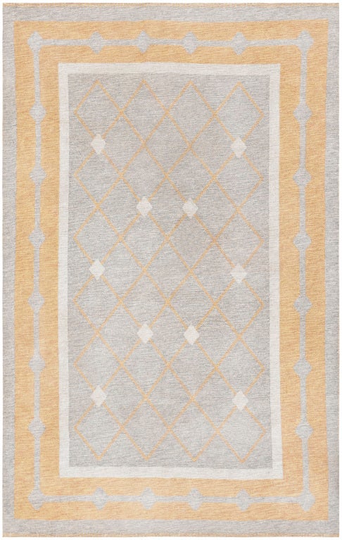 Sleek and sophisticated, this gorgeous double-sided Kilim showcases a superb latticework pattern accented with steely gray lozenges. This regal vintage Kilim features a sophisticated color palette with a warm mustard-yellow background that is paired
