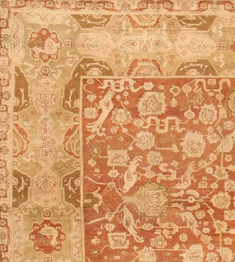 Antique Agra rug, late 19th century - This elegant antique Agra is the proud heir of a long tradition of Indian carpet weaving. A classical pattern of palmette arabesques with cloudbands and fantastic animals fills the field, while a cartouche