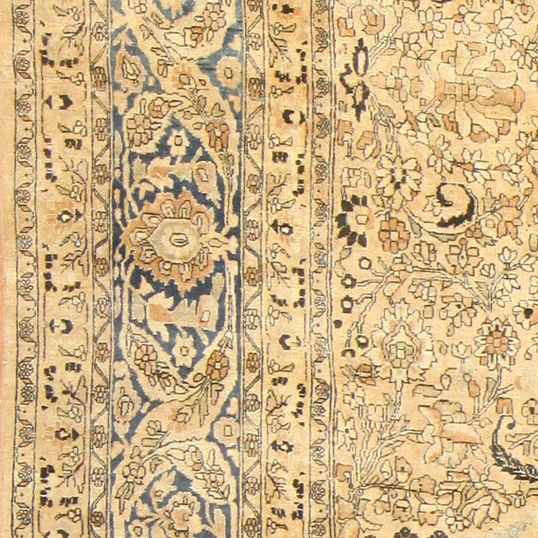 Antique Persian Khorassan Carpet, Early 20th Century -- Subtle yet powerful, the timeless beauty of our antique Persian carpet would bring a quiet brilliance to any home. The light brown background creates a perfect backdrop for the amazingly