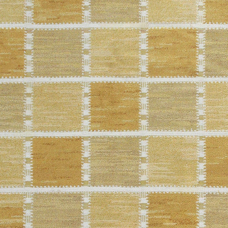 Woven in both pile and kilim / flat weave techniques, this idealistic carpet signed by Marta Maas Fjetterstrom, embodies the mid-century zeitgeist with minimalist tiles that use texture and color to develop patterns in an entirely new way. Subtly