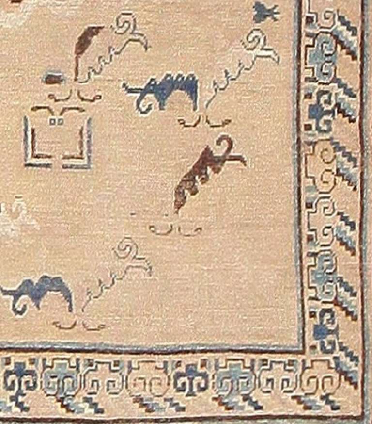 Hand-Knotted Antique Tiger Design Khotan Carpet From East Turkestan