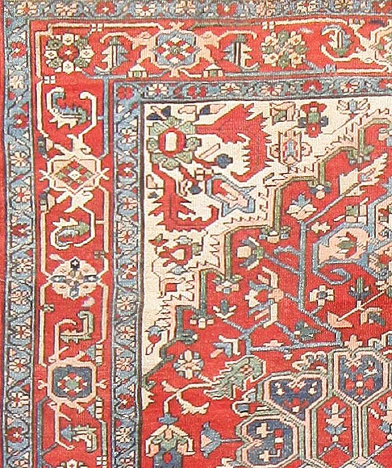 Here is a truly masterful antique Persian rug: this amazing carpet, a Heriz-Serapi, is practically bursting with a dynamic and powerful energy, the scale of its monumental medallion a bold and exciting statement in a piece steeped with classical