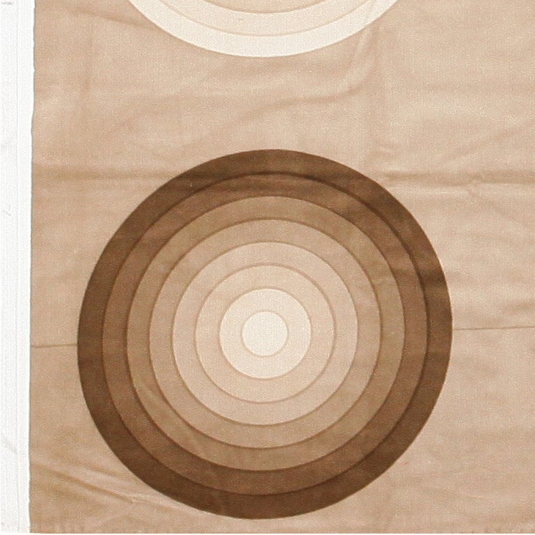 Vintage Verner Panton textile, Denmark, mid-20th century. Size: 3 ft 9 in x 3 ft 10 in (1.14 m x 1.17 m)

Balanced and symmetrical, this Verner Panton textile design features nine circles arranged in a grid. The color palette is defined by subtle